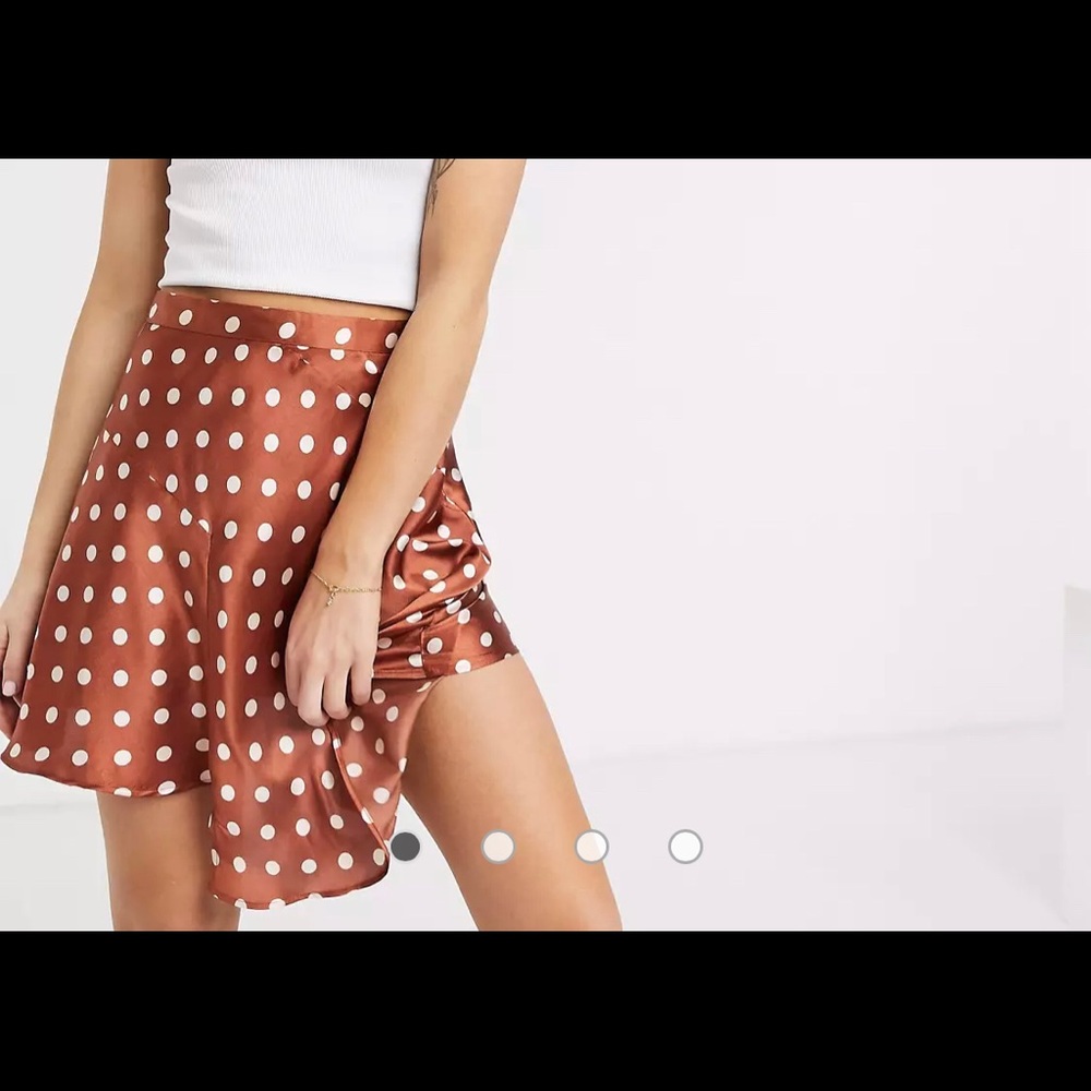 Silk polka dot skirt with asymmetrical cut